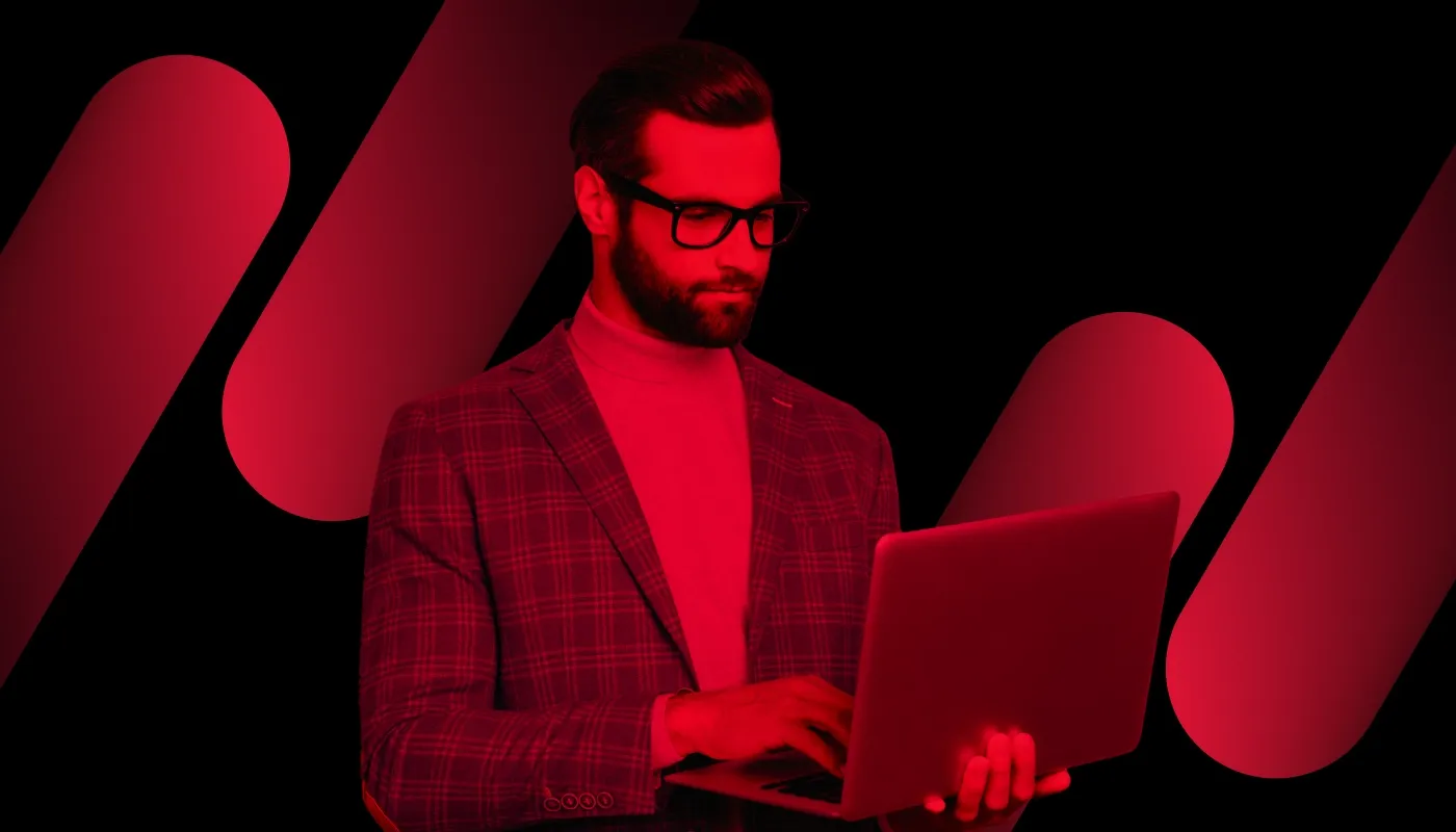 Standard red-hue cover image with a man on his laptop